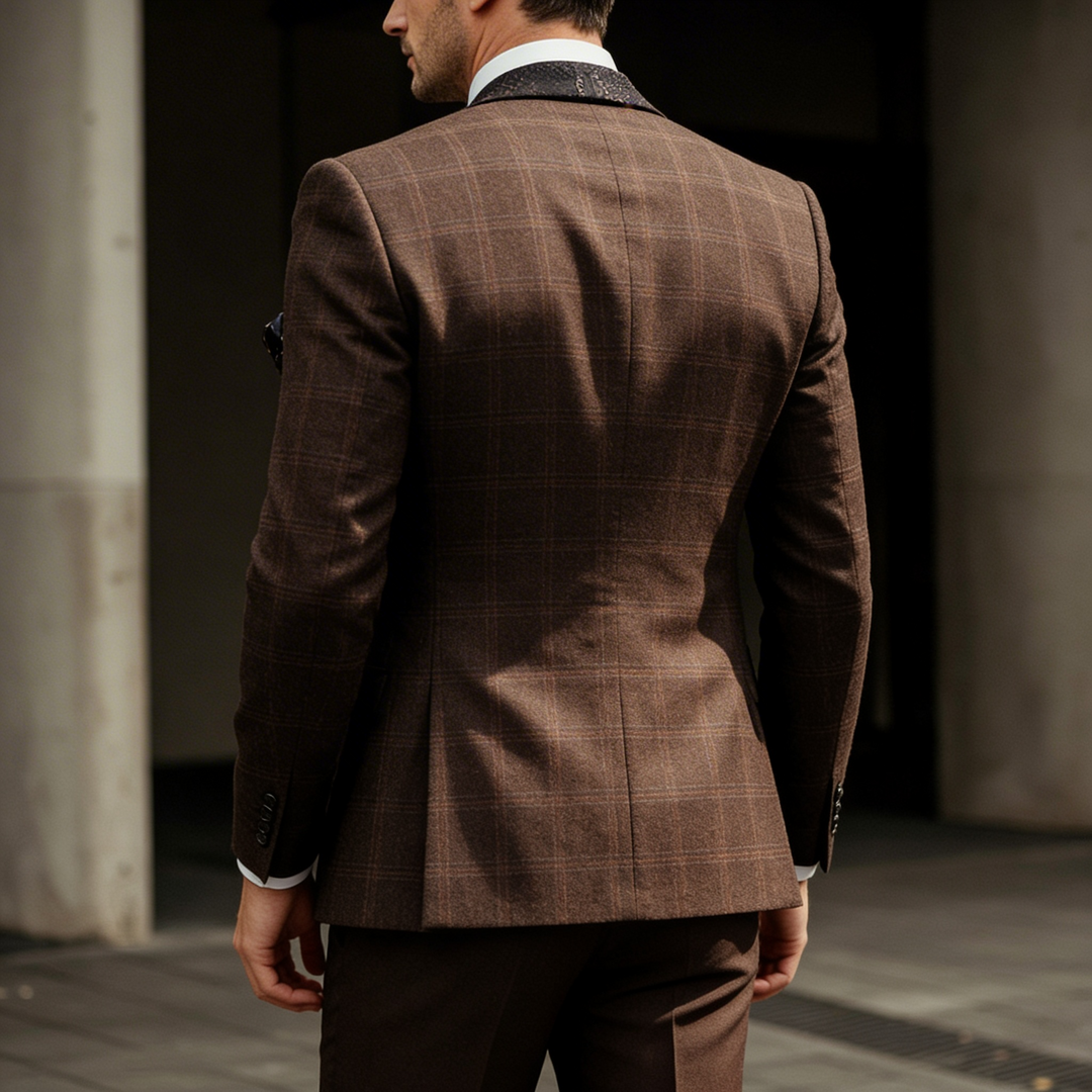 Man wearing brown checked blazer with tailored trousers and white formal shirt