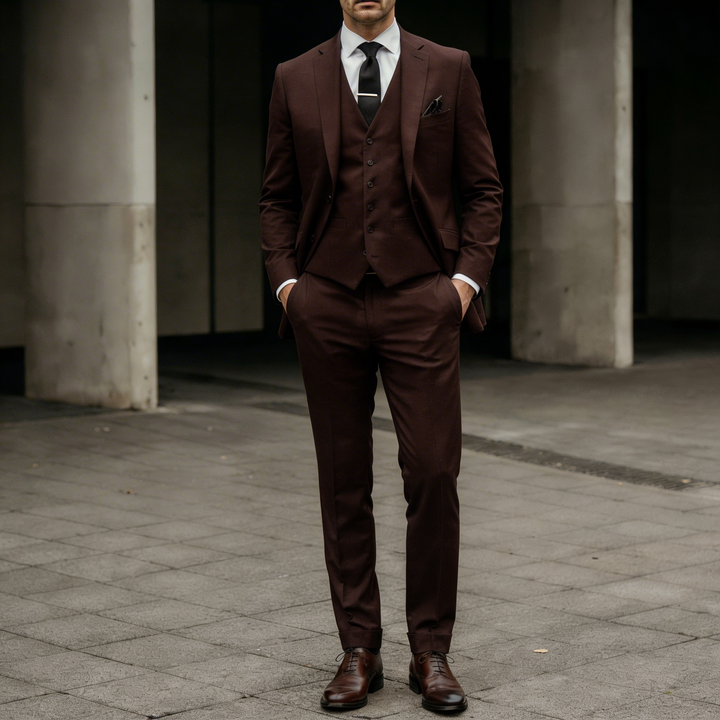 Deep chocolate brown tailored three-piece suit shown in a full body view