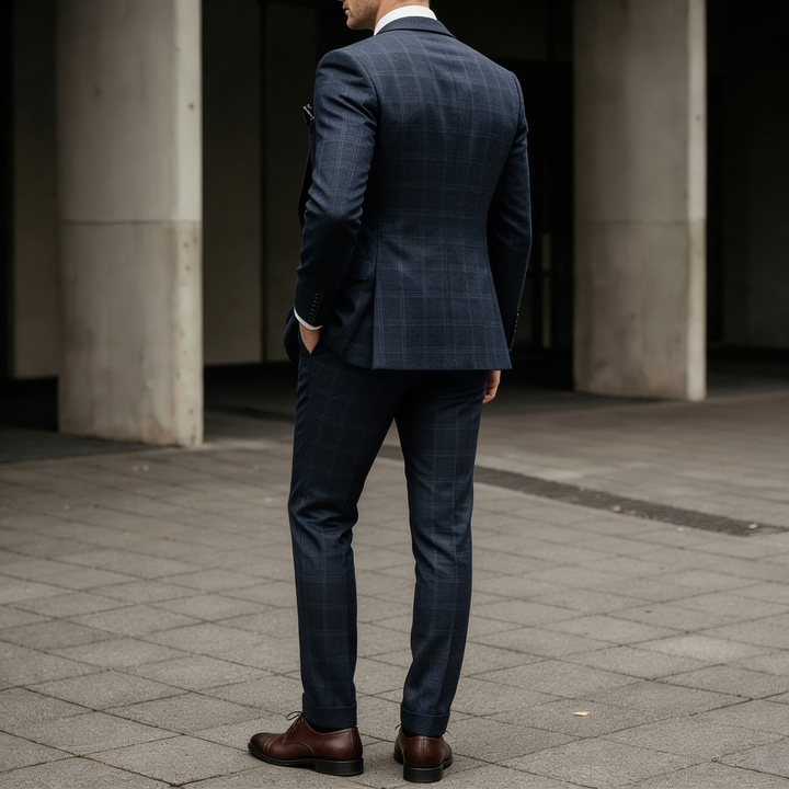 Deep navy blue plaid three-piece tailored suit in a premium formal style
