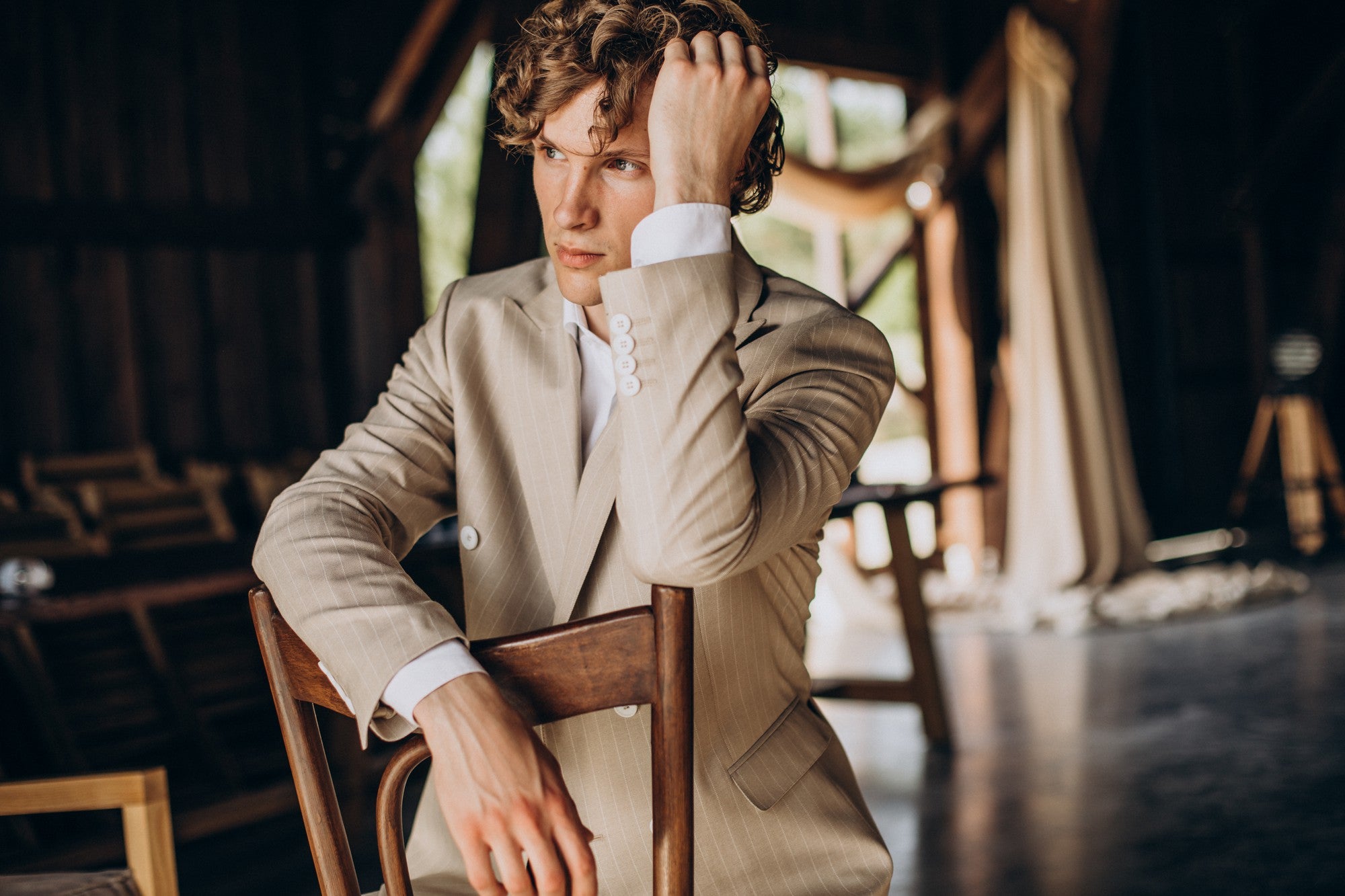 model sitting on a chair