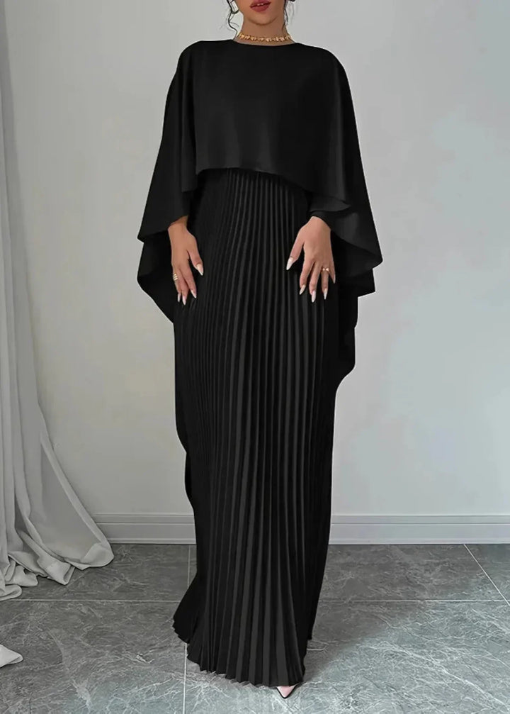 Sukienka maxi elegancka z asymetryczną narzutką, widok boczny na plisowany dół.