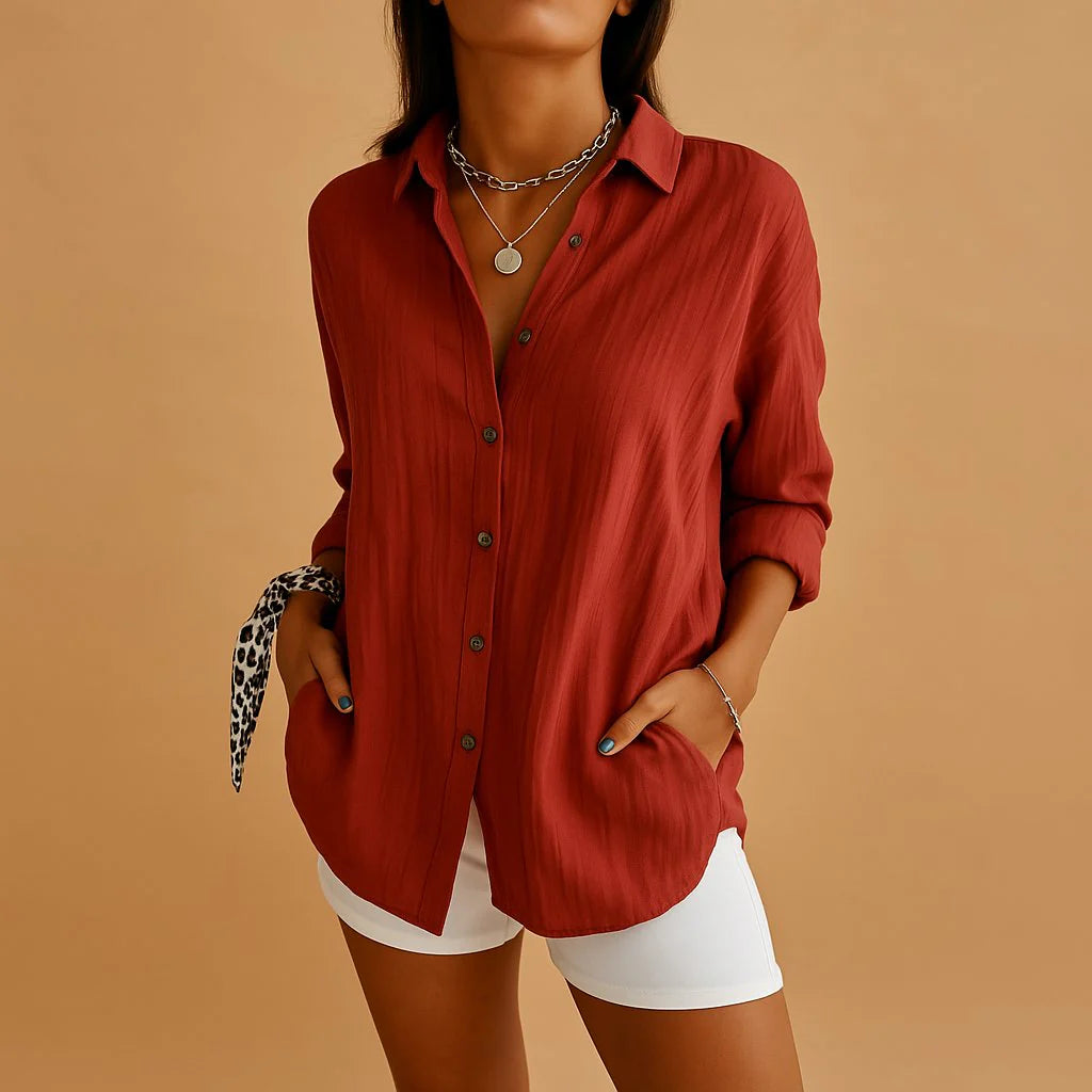 Damska koszula lniana z długim rękawem, dwie kieszenie boczne, zaokrąglony dół, widok z tyłu